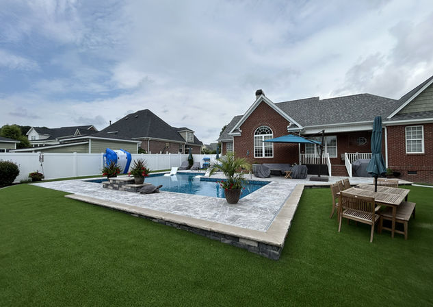Elevated Backyard Retreat with Custom Water Feature & Luxury Marble Deck