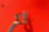 Worker painting ship hull on sherry picker using paint roller.jpg