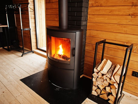 Modern double sided wood heater in Australian home