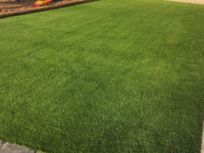 DelaTurf artificial grass installation in an Orlando backyard with no sprinklers running