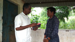 Lachhana receives Bible from Hanok Karad