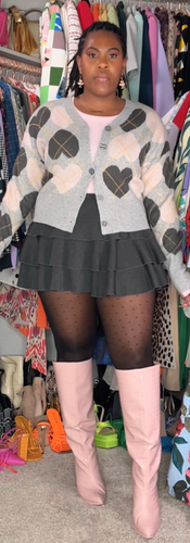 paired a light pink ribbed bodysuit with a heart argyle cardigan, a grey tiered mini, and sheer dot tights. Pink croc knee-high boots add the pop and keep it playful. Cozy prep for winter brunch, church, or a casual date. Save for outfit inspo and tell me if you’d wear it with tights or bare legs.