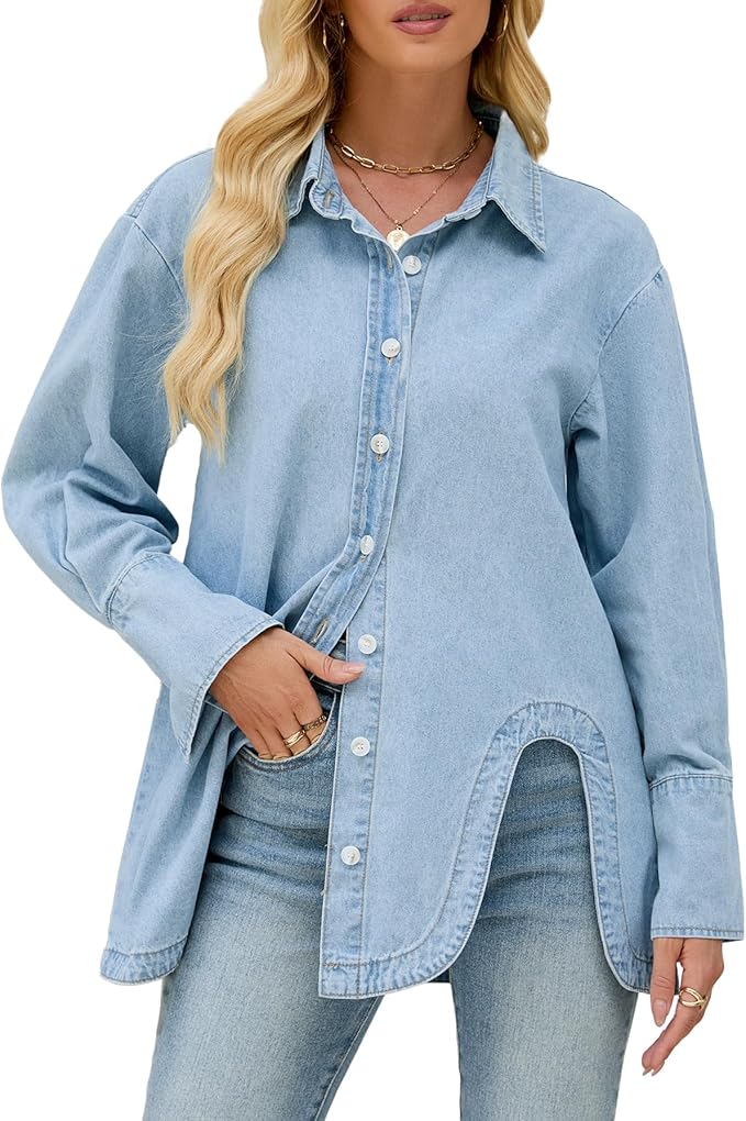 A woman wearing a light blue oversized denim button-down shirt, styled with subtle jewelry and a relaxed hairstyle, posing confidently.