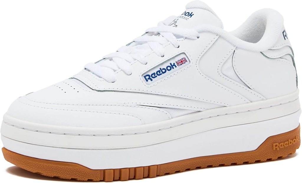 White Reebok sneakers with a gum sole, designed for casual and sporty looks.