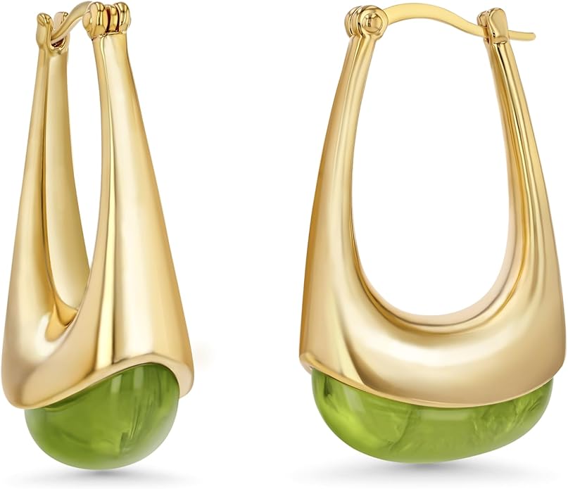 A pair of gold hoop earrings featuring a green gemstone at the bottom, showcasing a modern and stylish design.