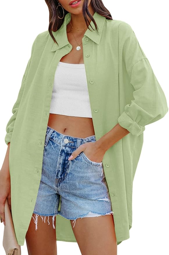 A model wearing a light green oversized button-down shirt over a white crop top and denim shorts, styled casually.