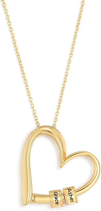 A gold heart-shaped necklace with personalized charms featuring names, symbolizing love and family.
