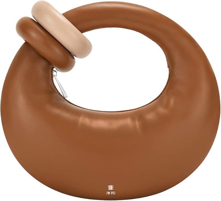 A stylish brown handbag with a unique circular shape and cream-colored handle detail, designed for versatile use.
