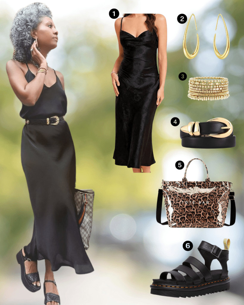 A woman in a stylish black slip dress stands confidently outdoors, paired with a black belt, accessorized with bold earrings and a bracelet. She holds a patterned handbag and wears trendy sandals.