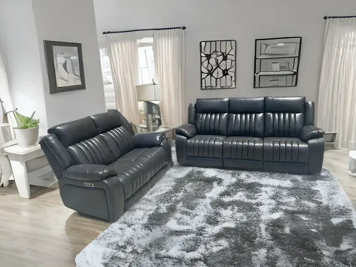 Dark gray leather reclining sofa and loveseat set