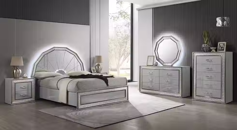 Modern bedroom suite with mirrored headboard and dresser