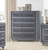 Gray tufted chest of drawers with five drawers and silver accents
