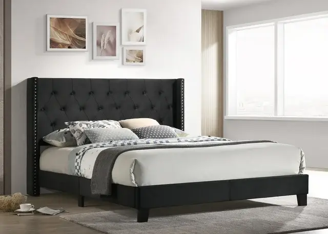 Black upholstered king bed frame with wingback headboard