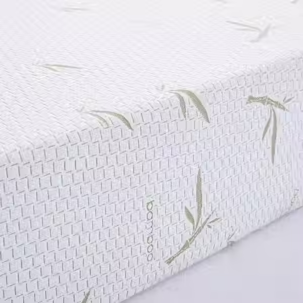 Close-up of damaged white mattress