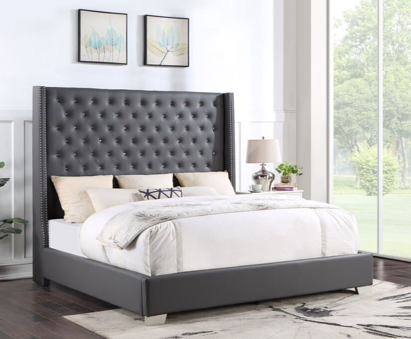 Gray upholstered wingback bed