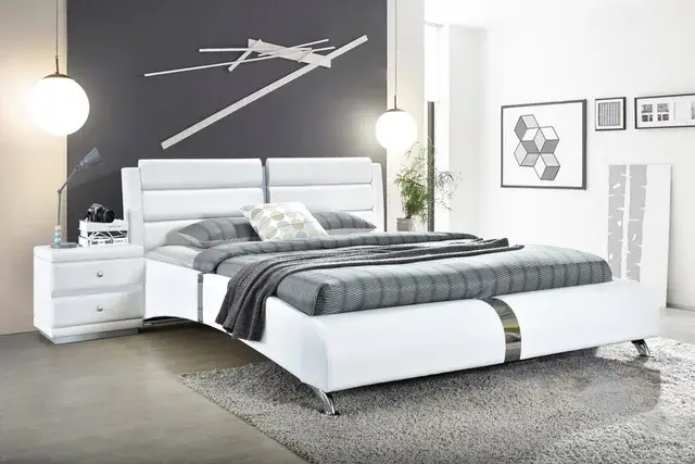 White leather bed with gray bedding