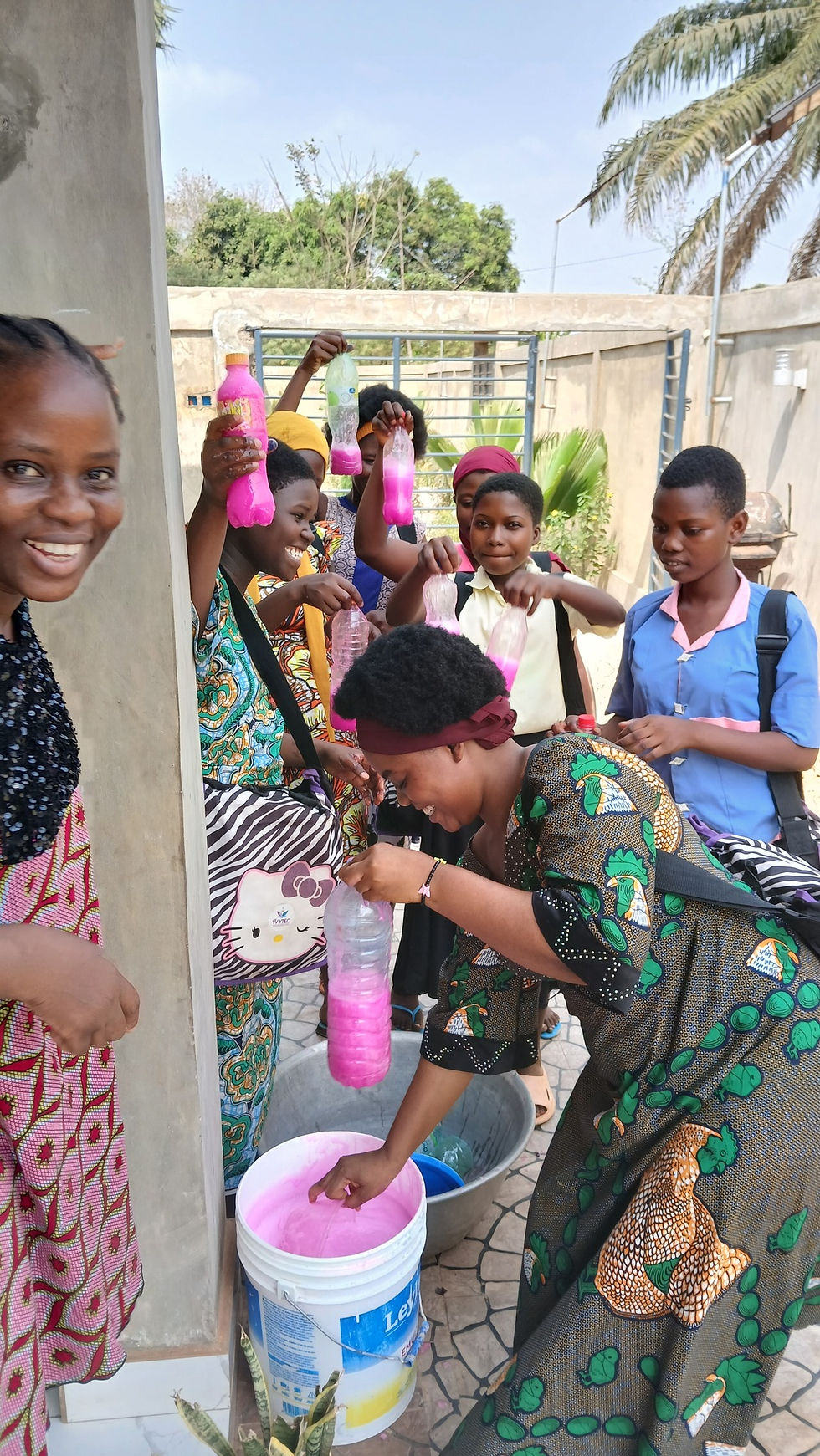 Eye-level view of a workshop setting with young women engaged in hands-on training