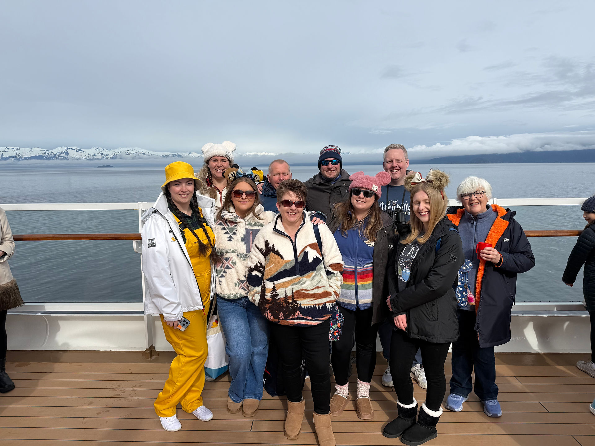 A group of friends on glacier viewing day onboard the Disney Wonder in Alaska