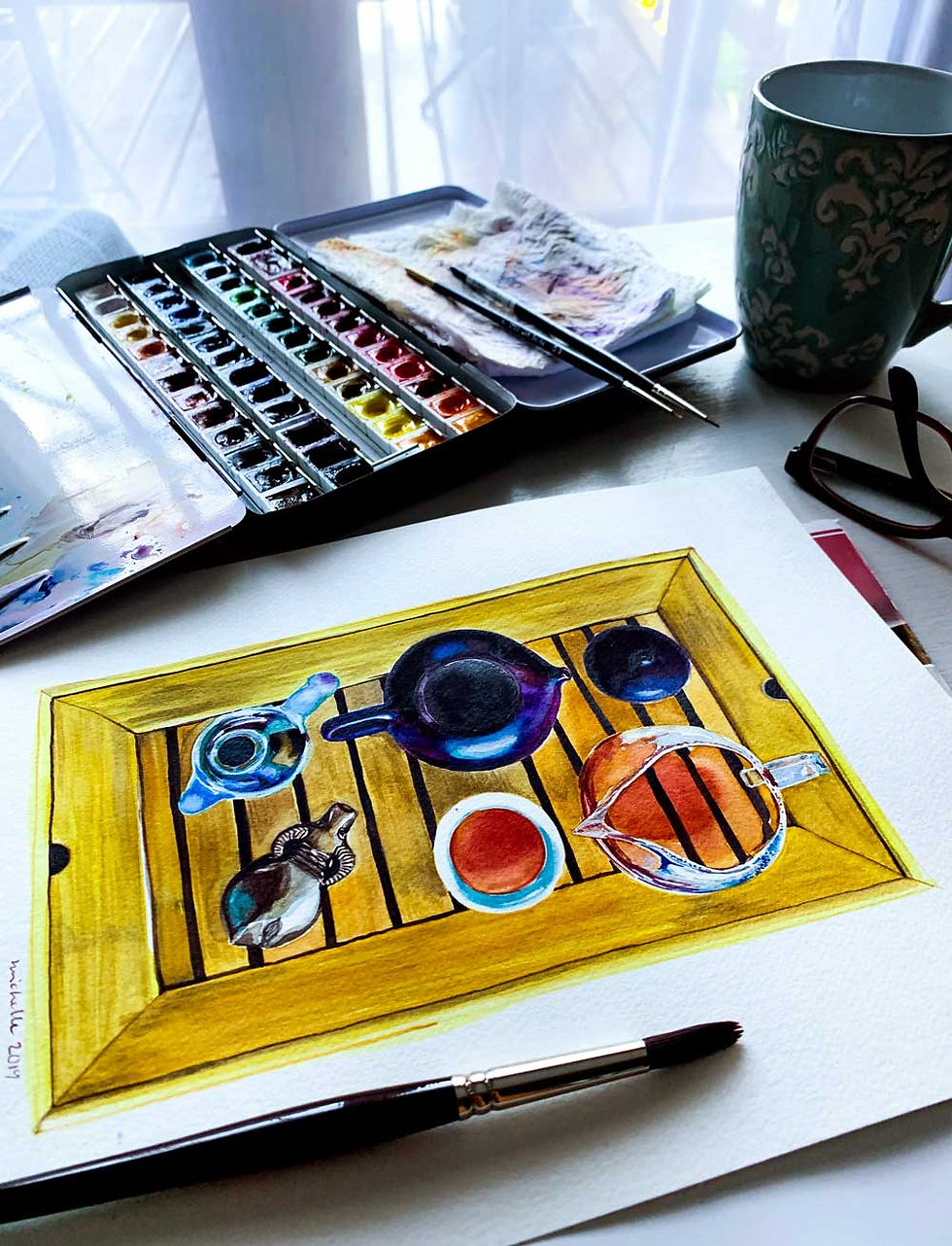 Watercolor paints and a painting of gongfu cha on a table