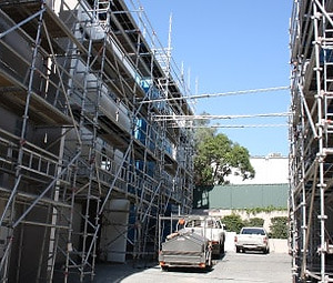 Building wrapped in scaffold