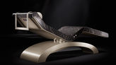 Rear view of Cleopatra Classico heated lounger by Fabio Alemanno, ideal for spa relaxation area; infrared marble seat.