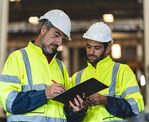 professional technician engineer with safety helmet hard hat working in industrial manufac
