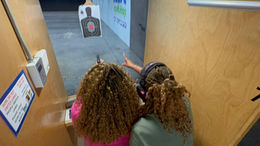 Lead instructor assisting client with qualification