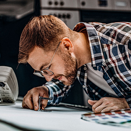man-working-printing-house-with-paper-pa