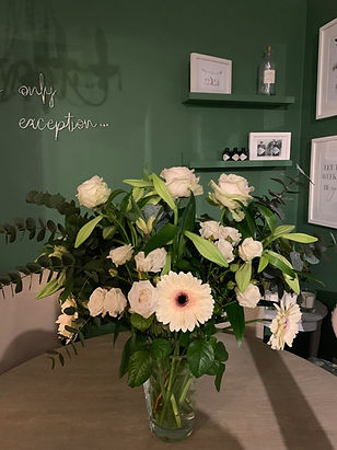 Green wall with floating shelves.JPG