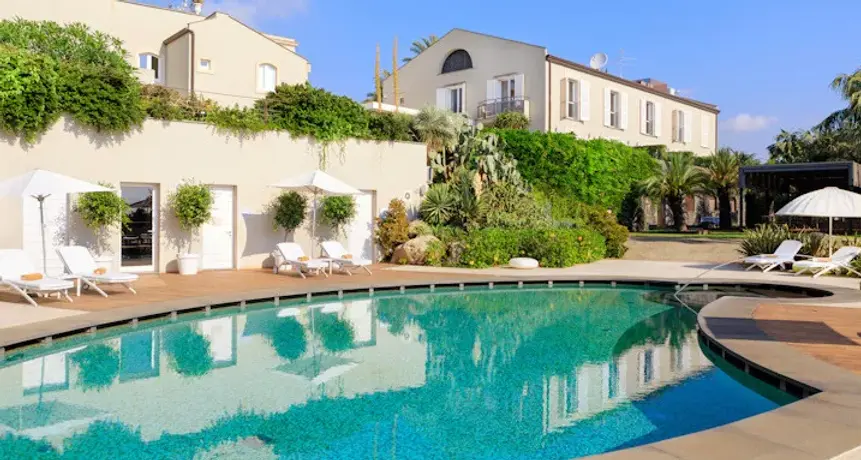 Exterior and swimming pool at Donna Carmela Resort