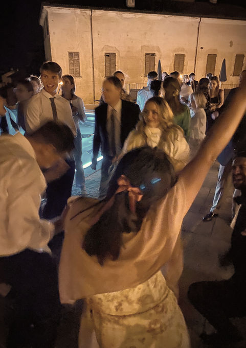 people dancing around the pool and having fun