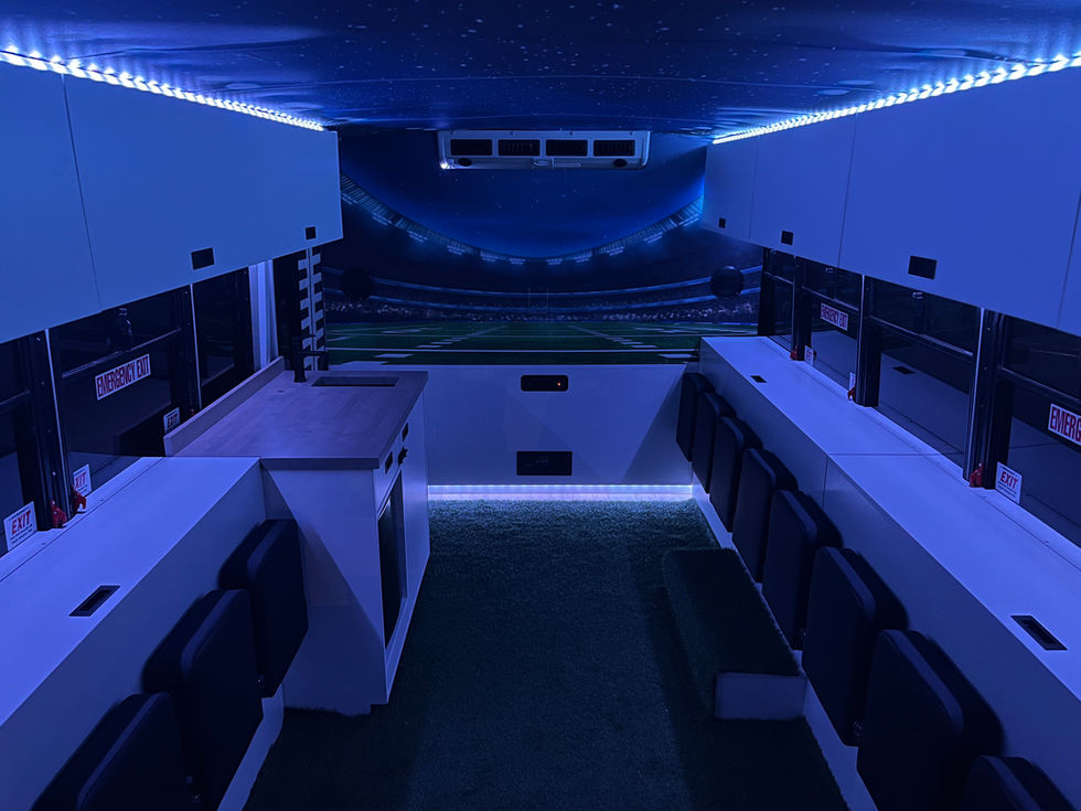 Mitzvah Tank 4 interior with custom stadium murals, LED accent lighting, and wall-lined theater-style seating for the ultimate game-day experience.