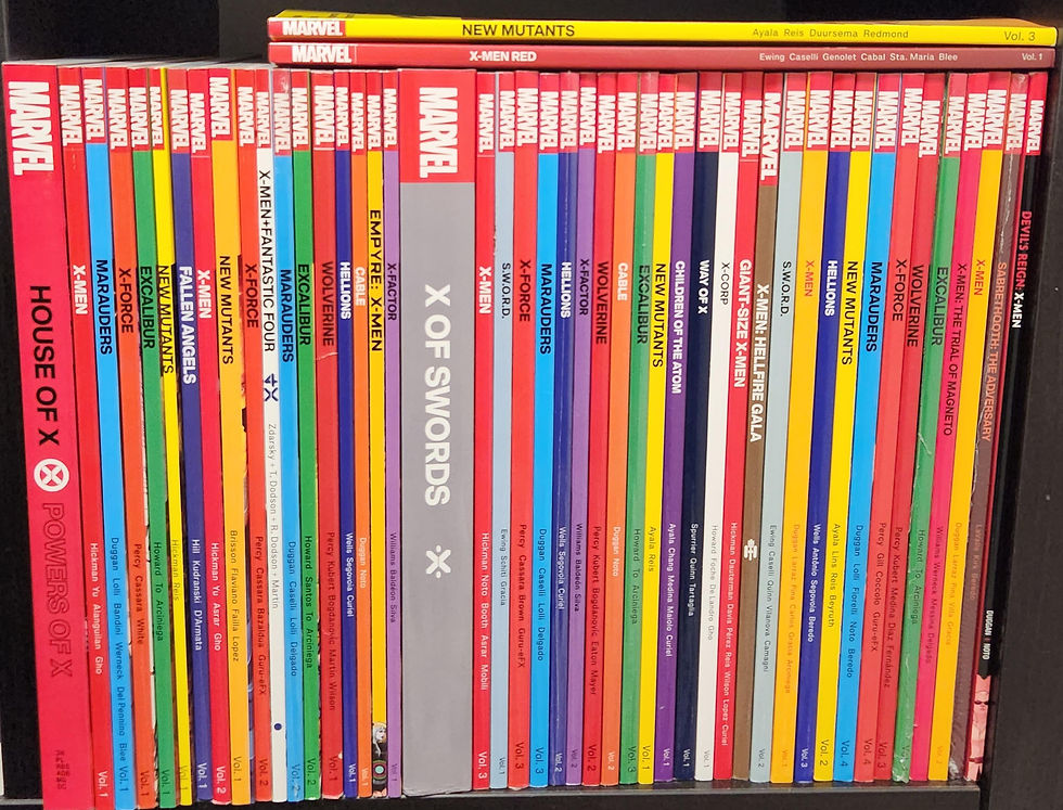 Colorful spines of Marvel comic books on a shelf, featuring titles like House of X and X of Swords in various vibrant hues.
