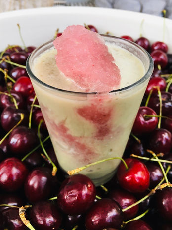 dessert in a cup - cherries around it