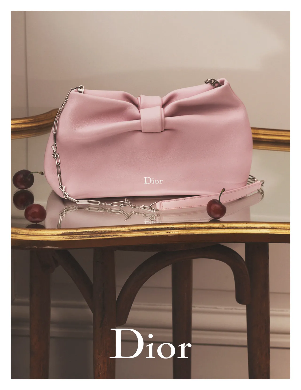 New Dior bag on gold table.