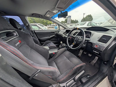 Honda Civic Type R FD2 interior with a Momo steering wheel and Recaro bucket seats