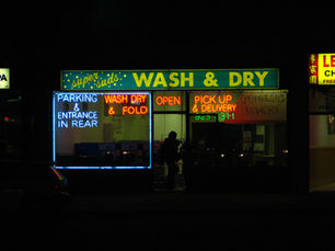 Neatly folded wash and fold laundry priced for profit