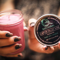 Close-up of woman's hands holding soy candle