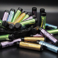 Several types of lip balms spilling from a basket