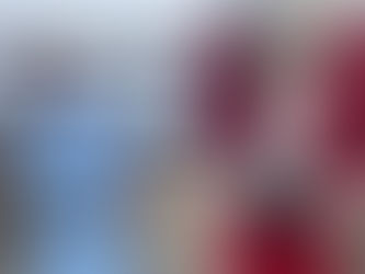 A little girl talks to a Santa in ski boots