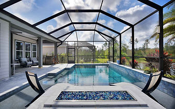 Black and White Pool Screen Enclosure with Custom Firepit and Entertainment Space.jpeg