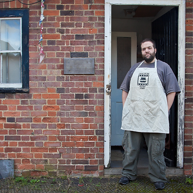 Pat first tried his hand at pottery in an evening class over a decade ago. He was quickly taken in by the medium and has had own ceramics studio for almost as long, beginning with a fellowship at Digswell Arts before moving to his current space in Hertford.
His work is in the form of functional art, such as hand-thrown kitchenware, and more decorative sculptural pieces.
Pat’s focus is on experimenting with dark, heavily grogged clays; hand-building vessels with beaten, sawn and carved facets. Raku firing crowns the pieces with blackened, charred and metallic surface finishes. Inspired by meteors on impact, the results are striking, heavily textured, tactile works that iridesce.
Pat spends much of his time outside of the studio teaching curious makers to explore their creativity and become more skilled in using clay as an artistic medium.
