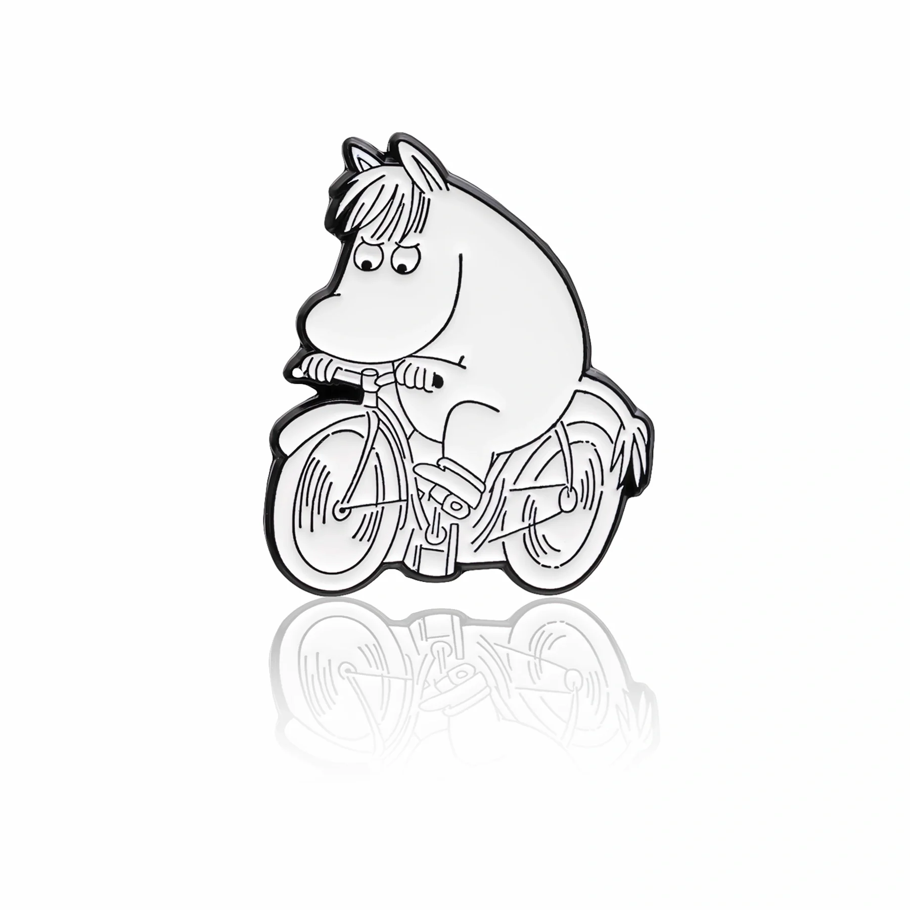 A pin badge featuring a Moomin character riding a bicycle. Monochrome design
