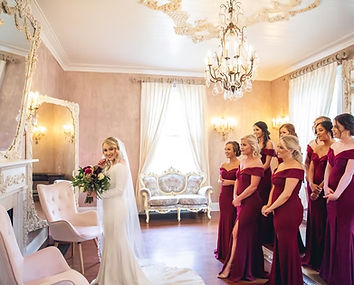 Bridesmaids admiring a bide