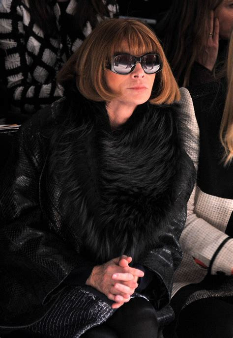 Anna Wintour sitting front row at fashion week.