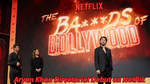 Three people stand on stage against a fiery Netflix backdrop with "The BA****DS of Bollywood." Text reads, "Aryan Khan Directorial Debut."