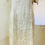 Thumbnail: Full front view of the New York print maxi dress in natural colour with overlapping V neck and elbow length straight sleeves