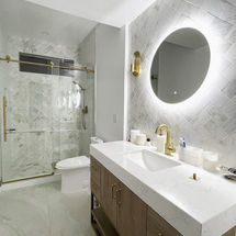 Modern bathroom remodel Los Angeles with double vanity LED mirror quartz countertop and glass shower