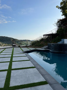 modern pool layout with walkway and grass joints design