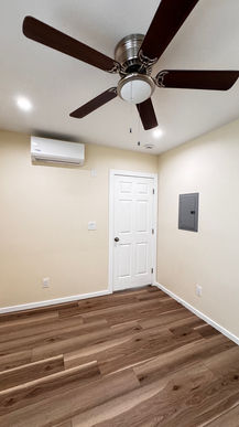 ceiling fan and lighting in converted garage interior